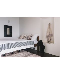 Hand-Woven Moroccan Pom Pom Blanket in White with Black Pom Poms
