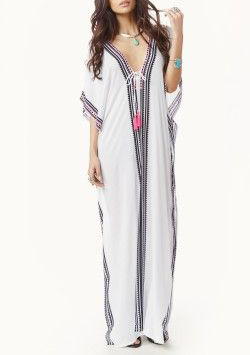 Moroccan-Inspired Embroidered Kaftan Dress for Bohemian Chic Statement.