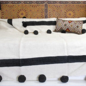 Handwoven Moroccan Cotton Blanket with Red Pom Poms