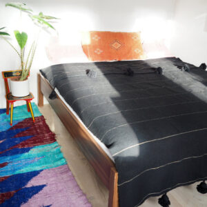 Moroccan Pom Pom Wool Blanket with Black Poms. Luxurious & Versatile Dark Grey Throw - Handwoven by Artisans.