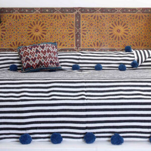 "Handcrafted Moroccan Pom Pom Wool Blanket - Versatile and Cozy"