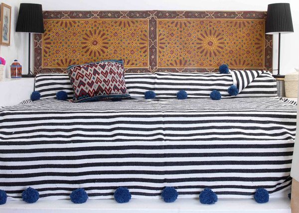 "Handcrafted Moroccan Pom Pom Wool Blanket - Versatile and Cozy"