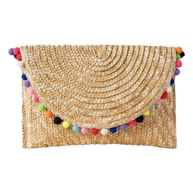 Moroccan Handwoven Straw Pom Pom Clutch