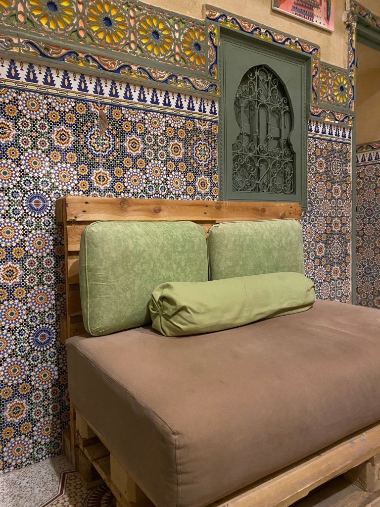 Zellige wall behind the daybed
