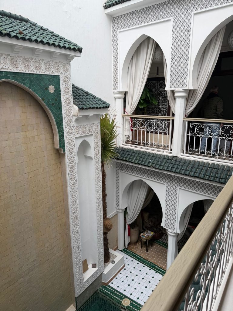 Green tile balcony above the hall