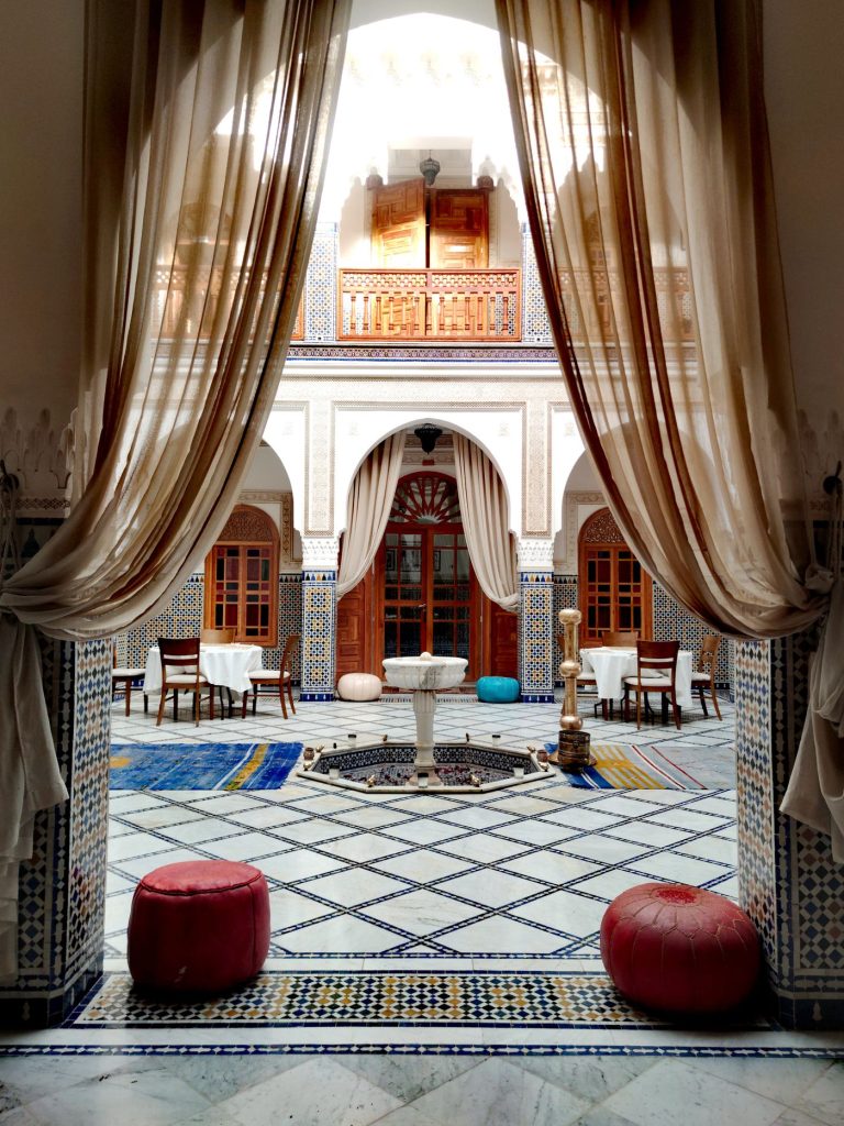 Courtyard dining behind linen drapes